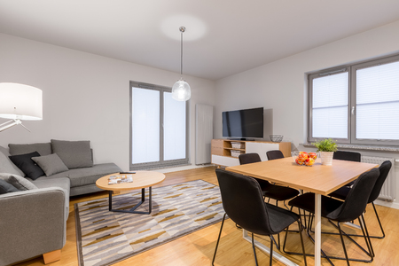 Luxury designed living room with big windows and modern furnitureの写真素材