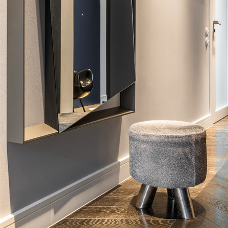 Elegant, small and decorative stool in stylish home corridorの写真素材