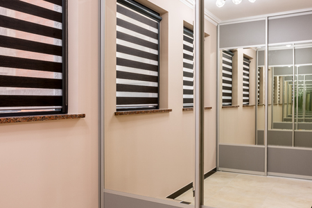 Home interior with functional wardrobe with mirror sliding doorの写真素材
