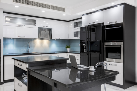 Black and white, stylish, high gloss kitchen with islandの写真素材