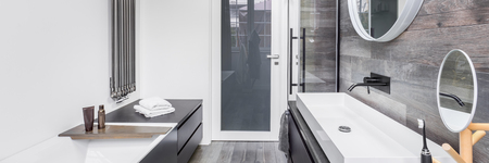 Bathroom with white wall and wood effect tiles, panoramaの写真素材