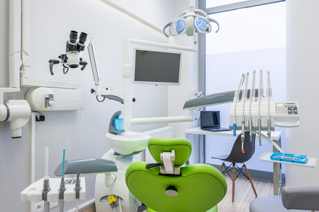 White interior with modern dental unit, screen and digital radiography deviceの写真素材