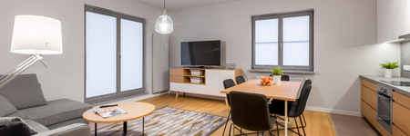 White loft apartment with open living room, panoramaの写真素材