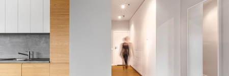 Long modern hallway with large, white wardrobe and next to kitchen, panoramaの写真素材
