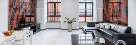 Luxury, white loft apartment with sofa, table, window, gloss floor and design wall tiles, panoramaの写真素材
