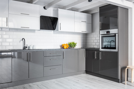 Gray and white kitchen with modern brick wallの写真素材
