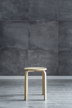 Interior with modern cement wall and simple wooden stoolの写真素材