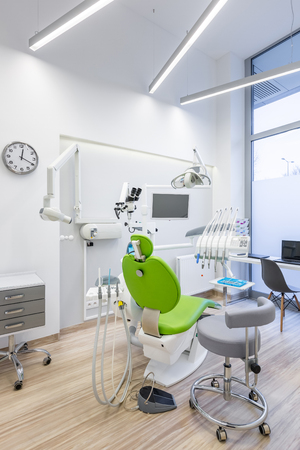 Dental treatment room with modern green chairの写真素材