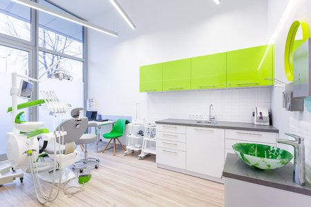 Modern dental room with green and white furnitureの写真素材