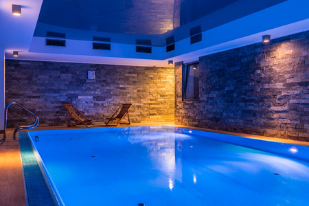 Modern and elegant swimming pool with brick wallの写真素材