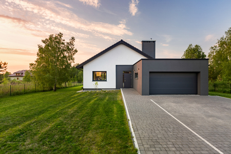 Simple and modern house with wide backyard and garageの写真素材