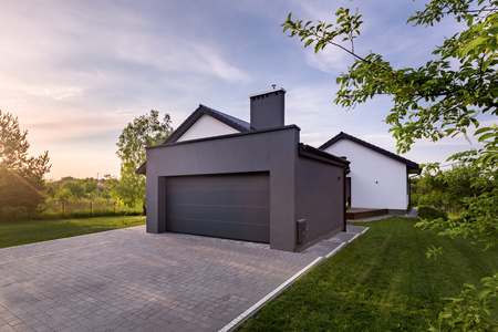 Exterior view of family house with garage and drivewayの写真素材