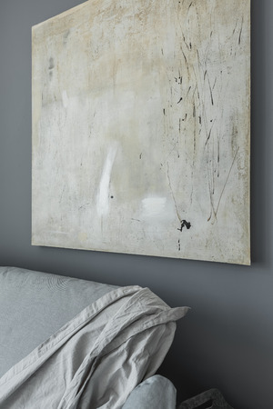 Modern apartment with gray wall, modern painting and sofaの写真素材