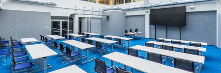 Panorama of modern and stylish university lecture hall in grey and blueの写真素材