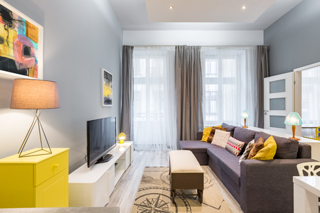 Cozy living room with tv, wheel coffee table and sofaの写真素材