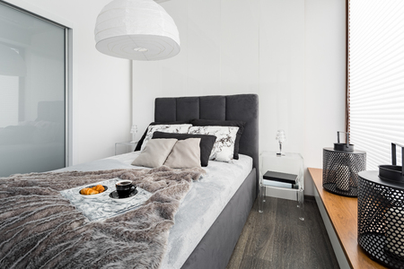 Bedroom with double bed and new design, transparent nightstandの写真素材