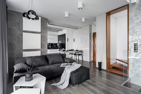 Living room in gray and white with corner sofa and coffee tableの写真素材