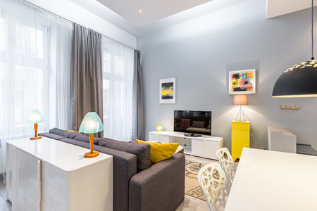 Contemporary tv living room with table, sofa and dresserの写真素材