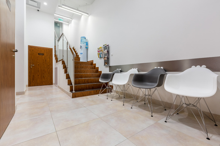 Waiting area in hallway with stairs in dental clinicの写真素材
