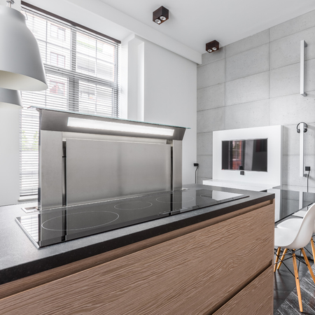 Modern induction hob in stylish granite kitchen worktopの写真素材