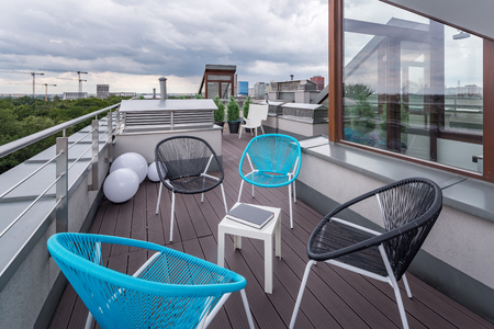 Perfect roof terrace with modern chairs and wooden deckingの写真素材