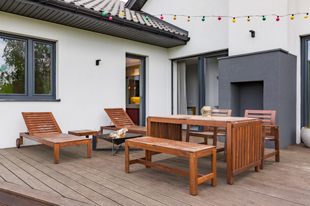 Luxurious villa with patio with wooden furniture setの写真素材