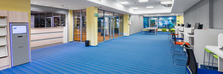 Panorama of modern computer room in university library with special device for returning booksの写真素材