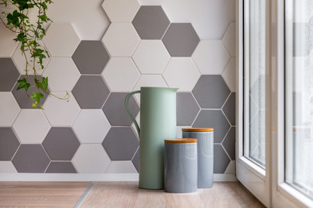 Home interior with hexagonal tiles, wooden countertop and decorative containers