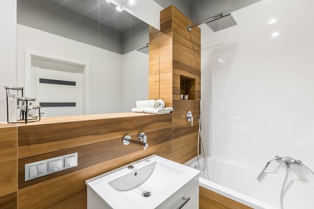 White and wood look ceramic tiles in contemporary bathroomの写真素材