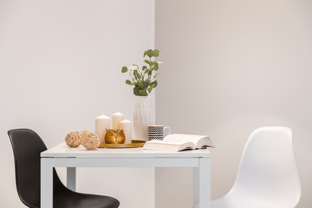 Home interior with simple white table and two chairsの写真素材