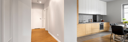 Panoramic view of apartment interior with white walls and hardwood floorの写真素材
