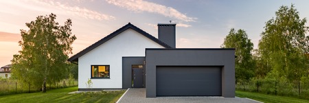 Exterior view of a modern white house with garage, panoramaの写真素材