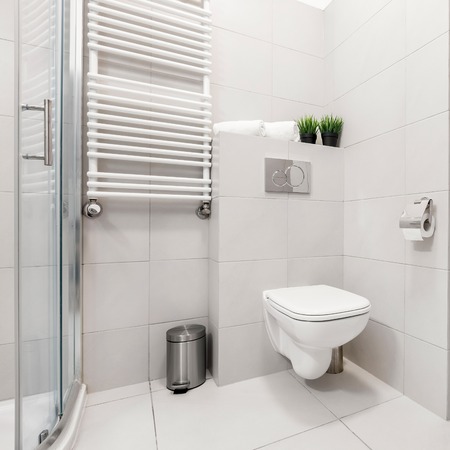 Modern, gray bathroom with washer, shower and toiletの写真素材