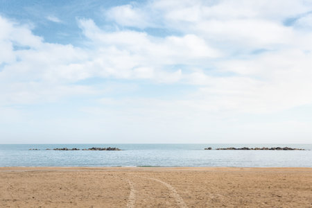 Empty wide beach with golden sand at adriatic sea, Pescara city, Italy