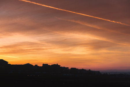 Golden sky during sunset over Pescara city in the shadow, Italyの写真素材