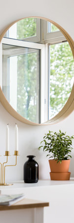Vertical panorama of home interior with decorative, round mirror
