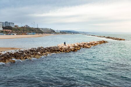 View from water on city and beach and adriatic sea in Termoli, Italyの写真素材