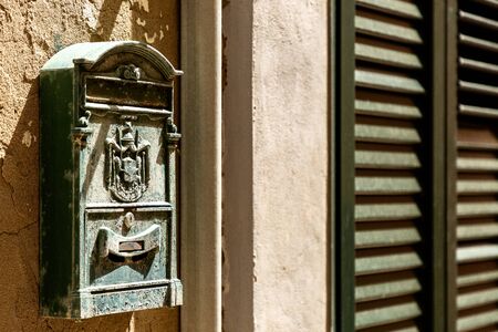 Beautiful aged mailbox on the wall of old building, architecture detailの写真素材