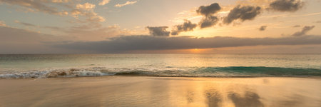 Panorama of beautiful and idyllic view of sunset over calm, blue ocean