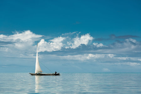 One fisher boat sailing on amazing blue ocean, Zanzibar islandの写真素材