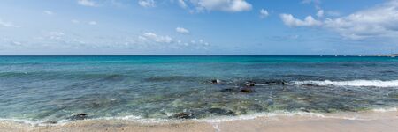 Panorama of waves on stony shore near beach in Santa Maria, Sal, Cape Verde, Cabo Verdeの写真素材
