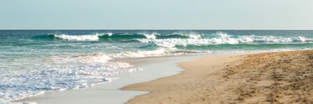 Panorama of big waves on turquoise atlantic ocean and golden beach at Sal island, Cabo Verde, Cape Verdeの写真素材