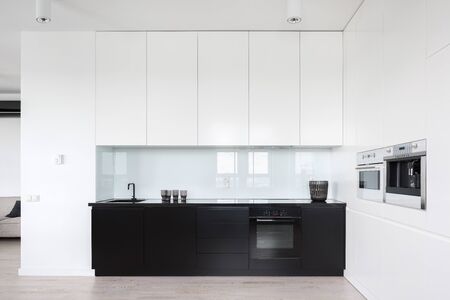 Modern and simple designed kitchen interior in black and whiteの写真素材