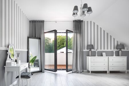 Romantic style gray room with white dressing table and chest of drawersの写真素材