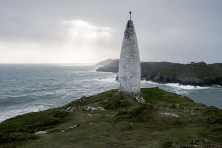 View at the Baltimore Beacon, entrance to the harbor at Baltimore, County Cork, Ireland with nice sunlight over seaの写真素材