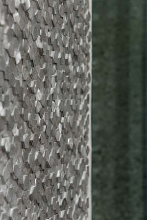 Close-up on silver wall tiles in hexagonal shape, architectural detailの写真素材