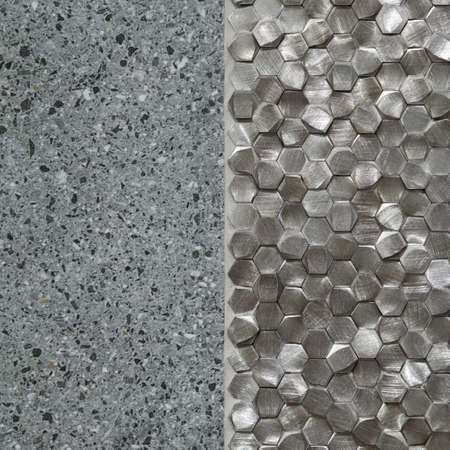 Close-up on gray, terrazzo tile and small, silver hexagonal tiles on wall, architectural backgroundの写真素材