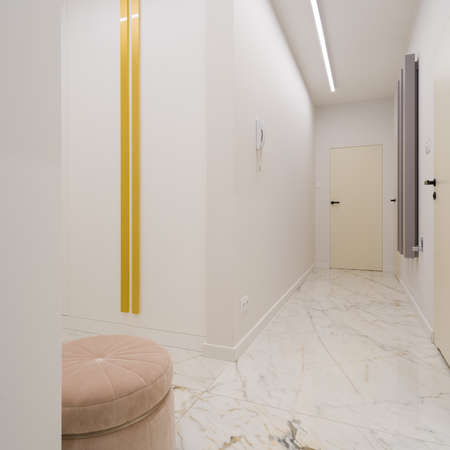 Spacious and elegant apartment corridor with white, marble floor tiles, modern ceiling light and stylish pink ottomanの写真素材