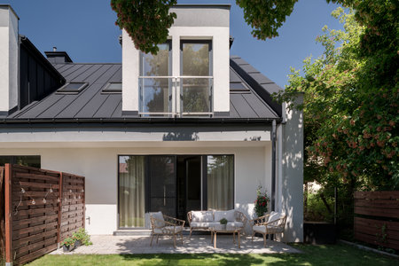 Simple garden space with furniture in elegant terraced house, exterior viewの写真素材