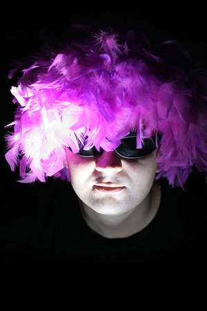 Crazy feathery man in spectaclesの写真素材